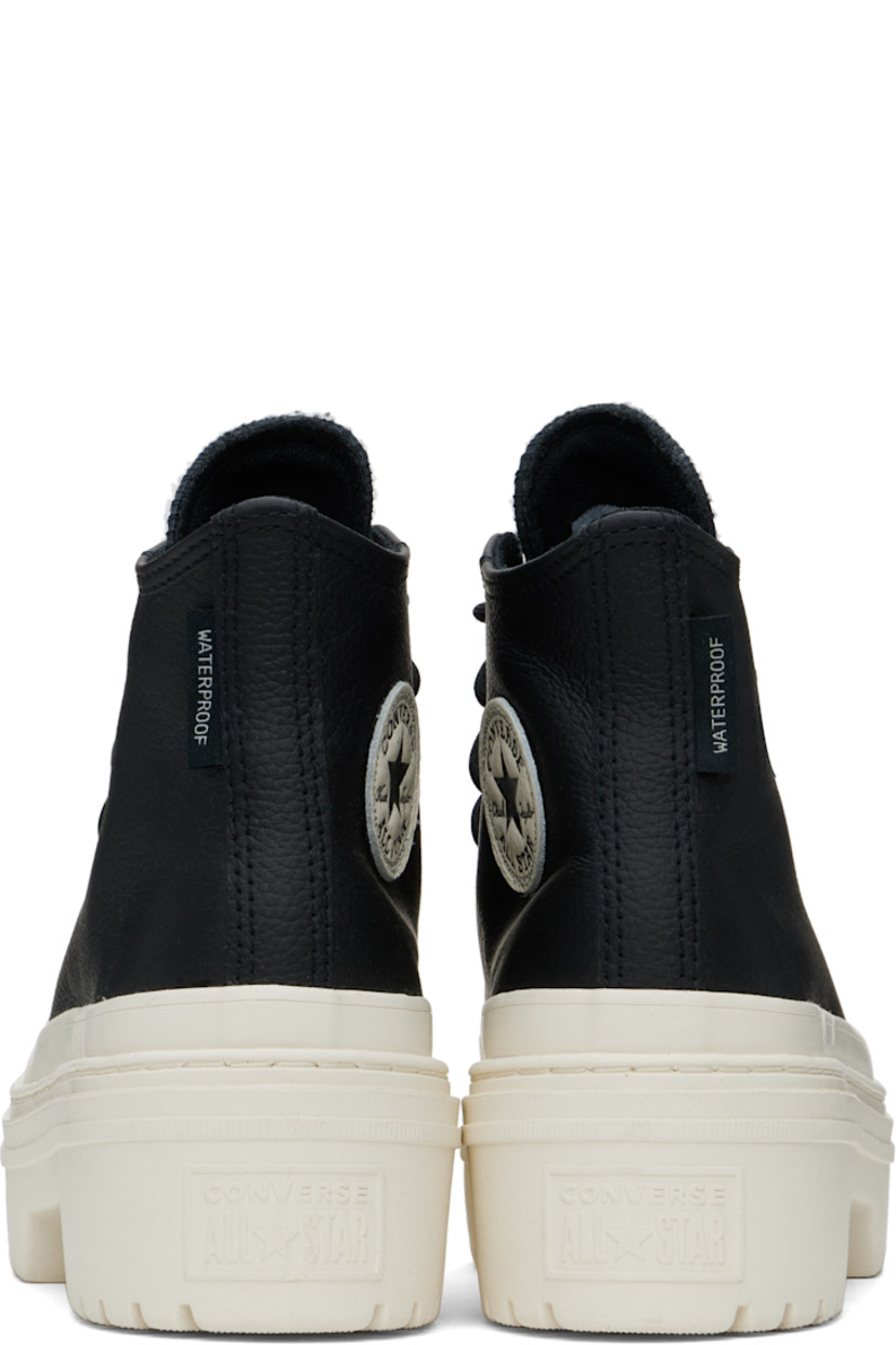 High-top grained leather sneakers in black.

· Thinsulate®-insulated and waterproof
· Rubber cap toe
· Lace-up closure
· Logo patch at inner side
· Cushioned OrthoLite® insole
· Mesh lining
· Rubberized trim at welt
· Logo embossed at heel
· Treaded rubber platform sole
· Platform: H1.5"
· Heel: H2"

Supplier color: Black/Black/Egret