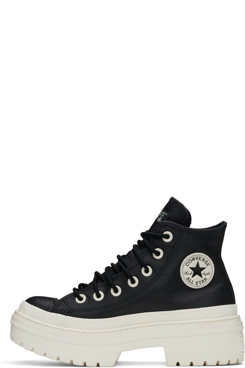 High-top grained leather sneakers in black.

· Thinsulate®-insulated and waterproof
· Rubber cap toe
· Lace-up closure
· Logo patch at inner side
· Cushioned OrthoLite® insole
· Mesh lining
· Rubberized trim at welt
· Logo embossed at heel
· Treaded rubber platform sole
· Platform: H1.5"
· Heel: H2"

Supplier color: Black/Black/Egret