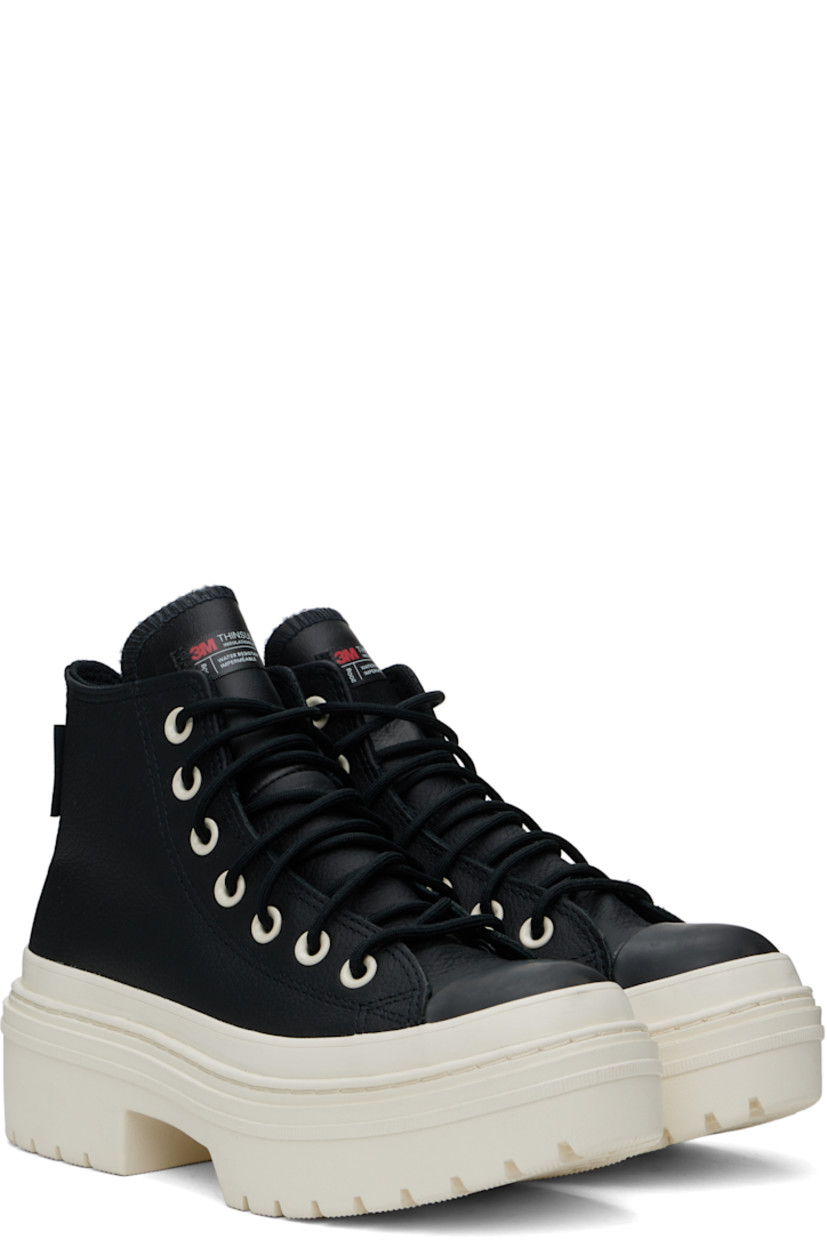 High-top grained leather sneakers in black.

· Thinsulate®-insulated and waterproof
· Rubber cap toe
· Lace-up closure
· Logo patch at inner side
· Cushioned OrthoLite® insole
· Mesh lining
· Rubberized trim at welt
· Logo embossed at heel
· Treaded rubber platform sole
· Platform: H1.5"
· Heel: H2"

Supplier color: Black/Black/Egret