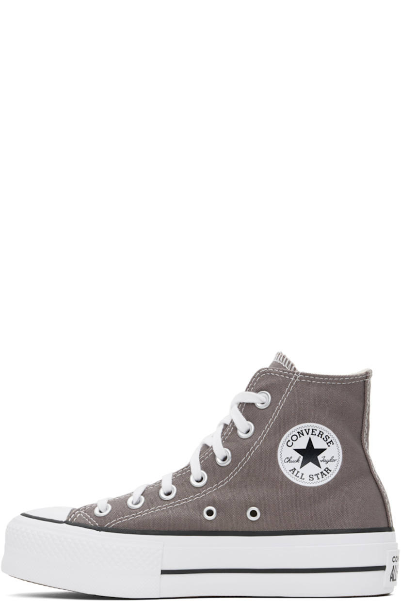 High-top canvas sneakers in taupe.

· Rubber cap toe
· Lace-up closure
· Logo patch and eyelets at inner side
· Cushioned OrthoLite® footbed
· Mesh lining
· Rubberized logo patch at heel
· Treaded rubber platform sole
· Contrast stitching in white
· Platform: H1.25"

Supplier color: Pure pumice/White/Black