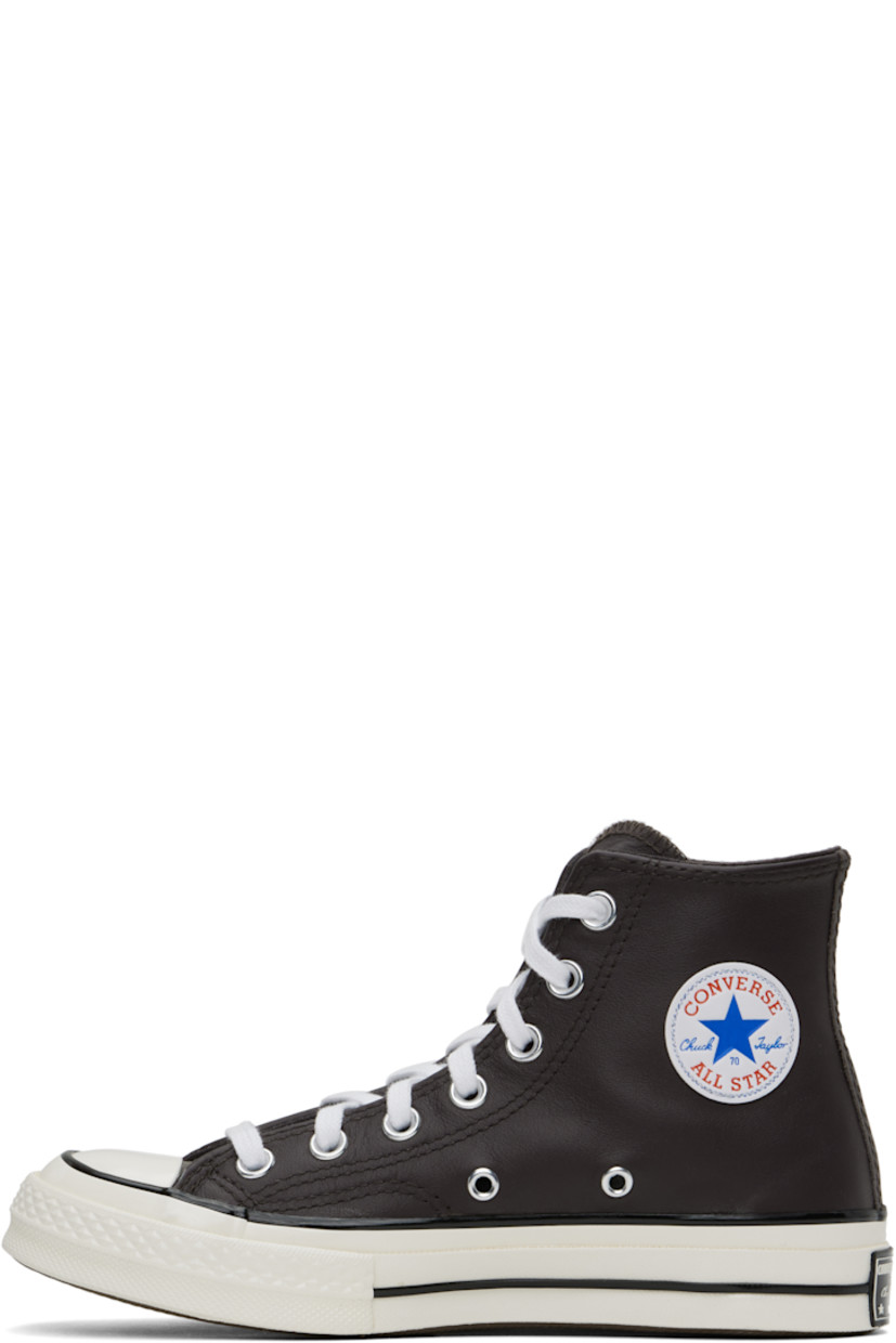 High-top grained leather sneakers in brown.

· Rubber cap toe
· Lace-up closure
· Logo patch and eyelets at inner side
· Cushioned OrthoLite® footbed
· Canvas lining
· Rubberized logo patch at heel
· Treaded rubber sole

Supplier color: Coffee nut/Blue/White