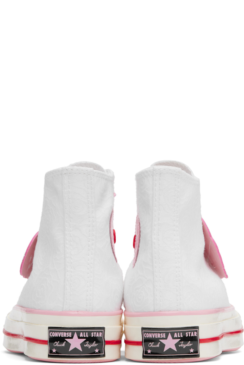 High-top canvas sneakers in white and pink.

· Jacquard floral pattern throughout
· Rubber cap toe
· Graphic charm and rubberized logo tag at lace-up closure
· Rubberized logo patch and eyelets at inner side
· Canvas lining
· Rubberized logo patch at heel
· Treaded rubber sole

Supplier color: Vintage white/Jellyfish