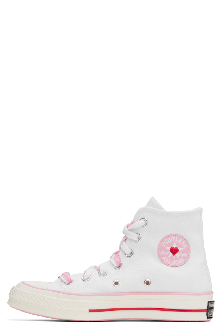 High-top canvas sneakers in white and pink.

· Jacquard floral pattern throughout
· Rubber cap toe
· Graphic charm and rubberized logo tag at lace-up closure
· Rubberized logo patch and eyelets at inner side
· Canvas lining
· Rubberized logo patch at heel
· Treaded rubber sole

Supplier color: Vintage white/Jellyfish