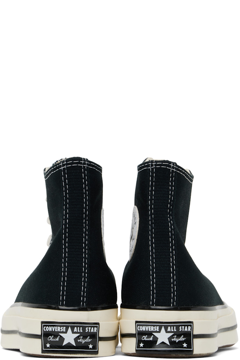High-top canvas sneakers in black.

· Rubber cap toe
· Lace-up closure
· Logo patch and eyelets at inner side
· Canvas lining
· Cushioned OrthoLite® footbed
· Rubberized logo patch at heel
· Treaded rubber sole
· Contrast stitching in white

Supplier color: Black/Black/Egret