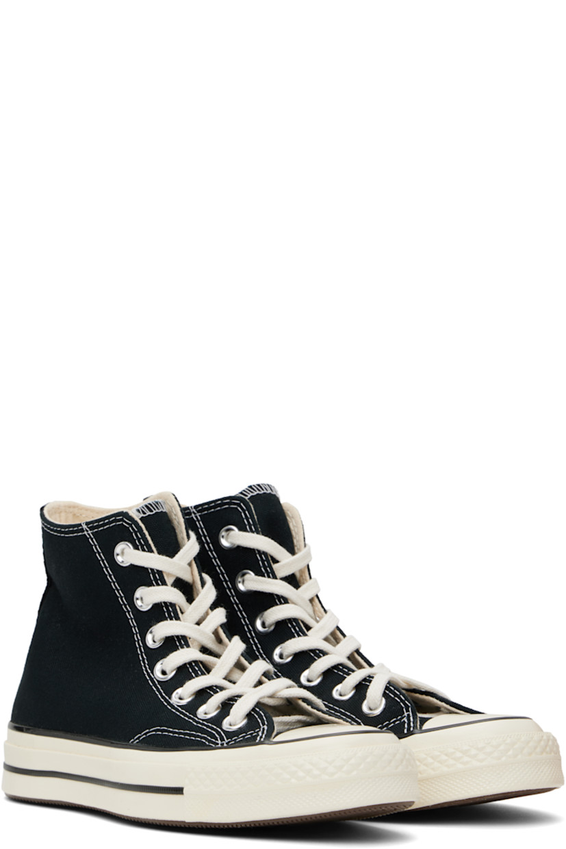 High-top canvas sneakers in black.

· Rubber cap toe
· Lace-up closure
· Logo patch and eyelets at inner side
· Canvas lining
· Cushioned OrthoLite® footbed
· Rubberized logo patch at heel
· Treaded rubber sole
· Contrast stitching in white

Supplier color: Black/Black/Egret