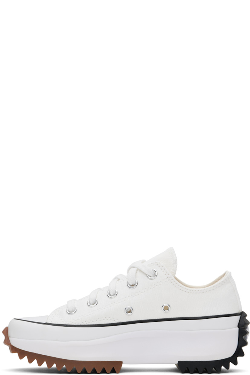 Low-top canvas sneakers in off-white.

· Rubber cap toe
· Lace-up closure
· Eyelets at inner side
· Rubberized logo appliqué at heel
· Cushioned OrthoLite® footbed
· Canvas lining
· Platform rubber midsole
· Treaded rubber sole
· Platform: H1.5"

Supplier color: White/Black/Gum