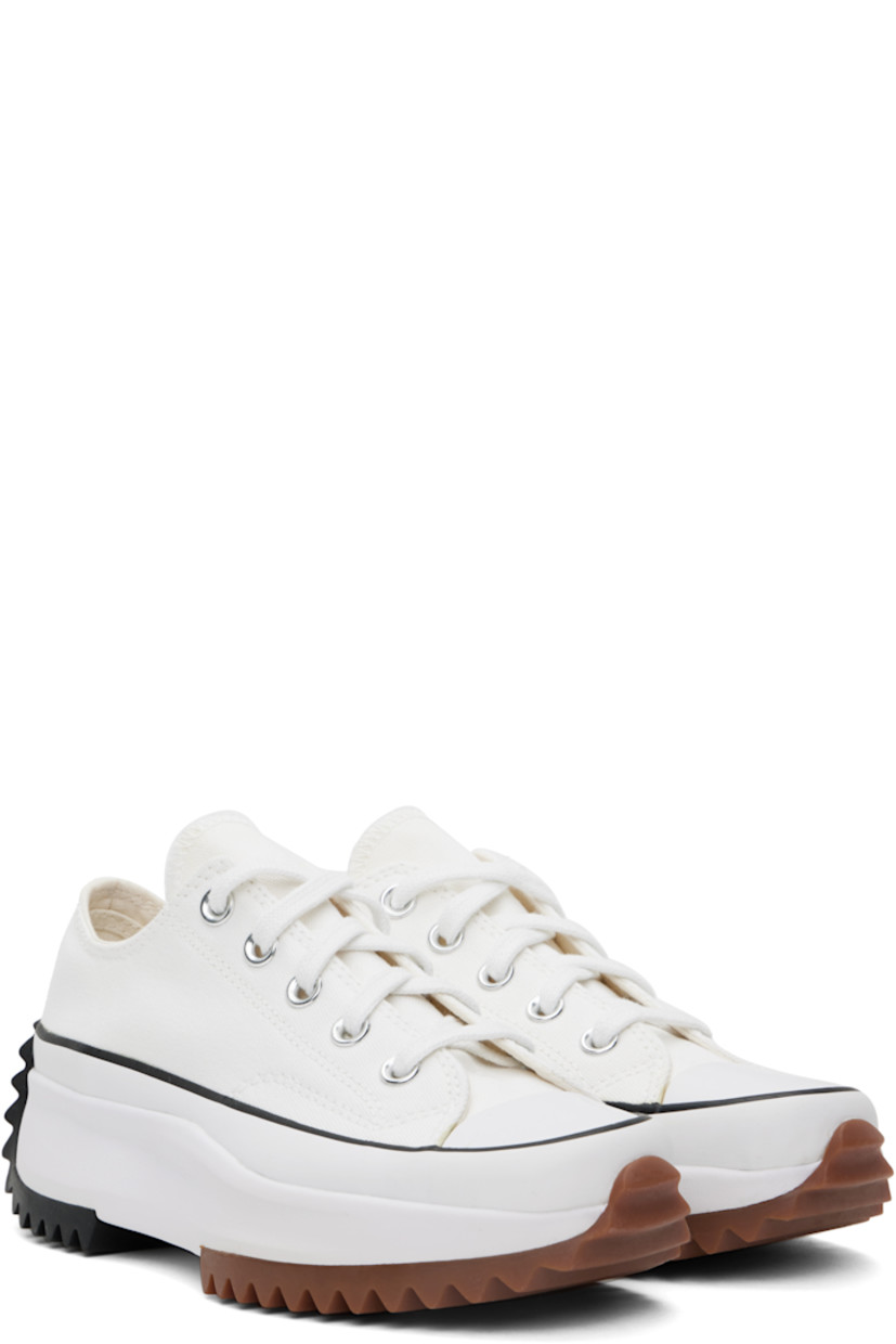 Low-top canvas sneakers in off-white.

· Rubber cap toe
· Lace-up closure
· Eyelets at inner side
· Rubberized logo appliqué at heel
· Cushioned OrthoLite® footbed
· Canvas lining
· Platform rubber midsole
· Treaded rubber sole
· Platform: H1.5"

Supplier color: White/Black/Gum