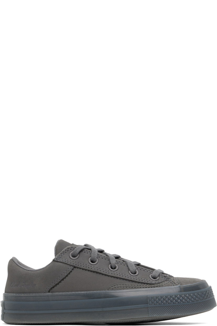 Low-top suede and nubuck sneakers in gray.

· Lace-up closure
· Logo patch at padded tongue
· Padded collar
· Logo embossed at outer side
· Rubberized logo patch at heel
· Cushioned CX foam footbed
· Mesh lining
· Treaded rubber sole

Supplier color: Sharkskin/Sharkskin/Sharkskin