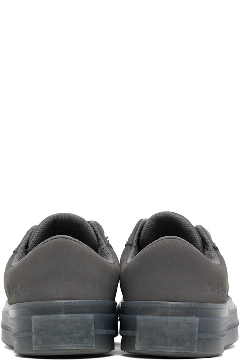 Low-top suede and nubuck sneakers in gray.

· Lace-up closure
· Logo patch at padded tongue
· Padded collar
· Logo embossed at outer side
· Rubberized logo patch at heel
· Cushioned CX foam footbed
· Mesh lining
· Treaded rubber sole

Supplier color: Sharkskin/Sharkskin/Sharkskin