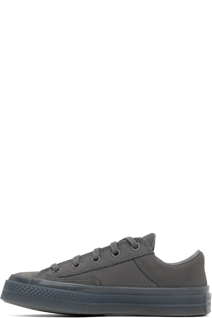 Low-top suede and nubuck sneakers in gray.

· Lace-up closure
· Logo patch at padded tongue
· Padded collar
· Logo embossed at outer side
· Rubberized logo patch at heel
· Cushioned CX foam footbed
· Mesh lining
· Treaded rubber sole

Supplier color: Sharkskin/Sharkskin/Sharkskin