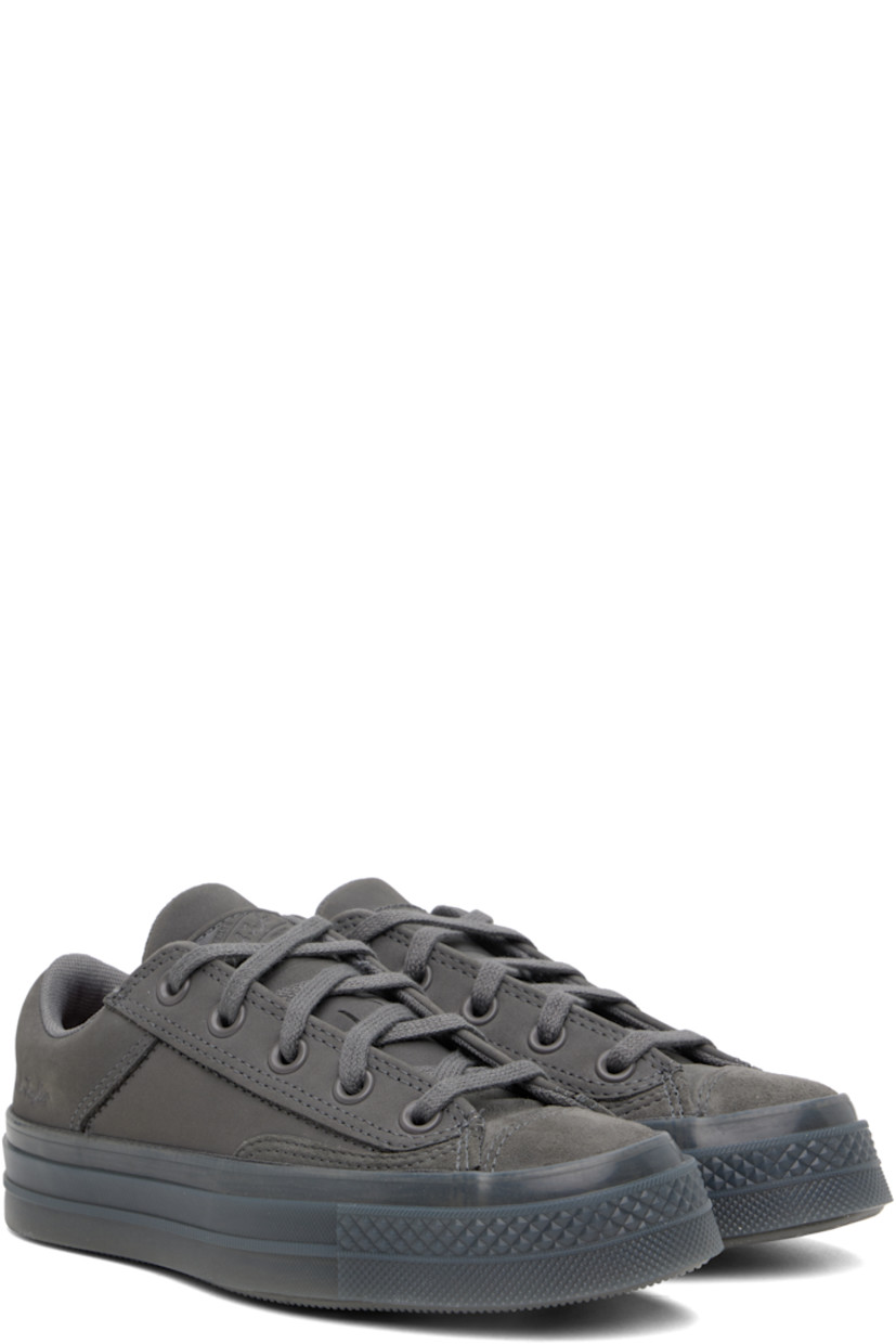 Low-top suede and nubuck sneakers in gray.

· Lace-up closure
· Logo patch at padded tongue
· Padded collar
· Logo embossed at outer side
· Rubberized logo patch at heel
· Cushioned CX foam footbed
· Mesh lining
· Treaded rubber sole

Supplier color: Sharkskin/Sharkskin/Sharkskin
