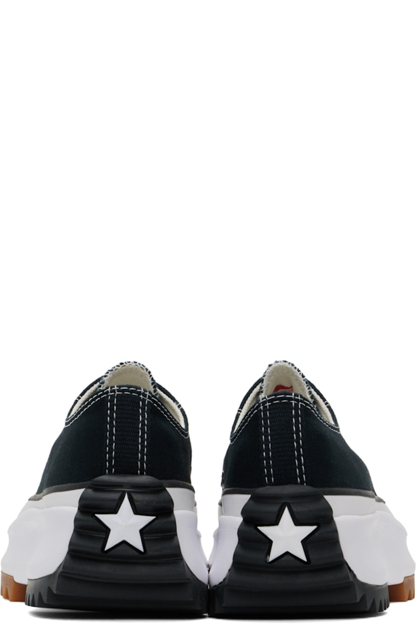 Low-top canvas sneakers in black.

· Rubber cap toe
· Lace-up closure
· Eyelets at inner side
· Cushioned OrthoLite® footbed
· Mesh lining
· Rubberized logo appliqué at heel
· Platform rubber midsole
· Treaded rubber sole
· Contrast stitching in white
· Platform: H1.5"

Supplier color: Black/White/Gum