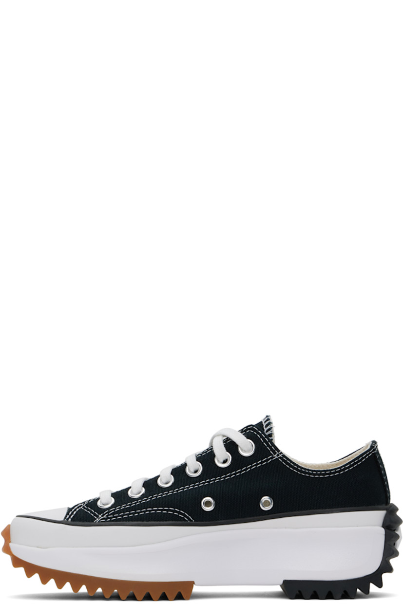 Low-top canvas sneakers in black.

· Rubber cap toe
· Lace-up closure
· Eyelets at inner side
· Cushioned OrthoLite® footbed
· Mesh lining
· Rubberized logo appliqué at heel
· Platform rubber midsole
· Treaded rubber sole
· Contrast stitching in white
· Platform: H1.5"

Supplier color: Black/White/Gum