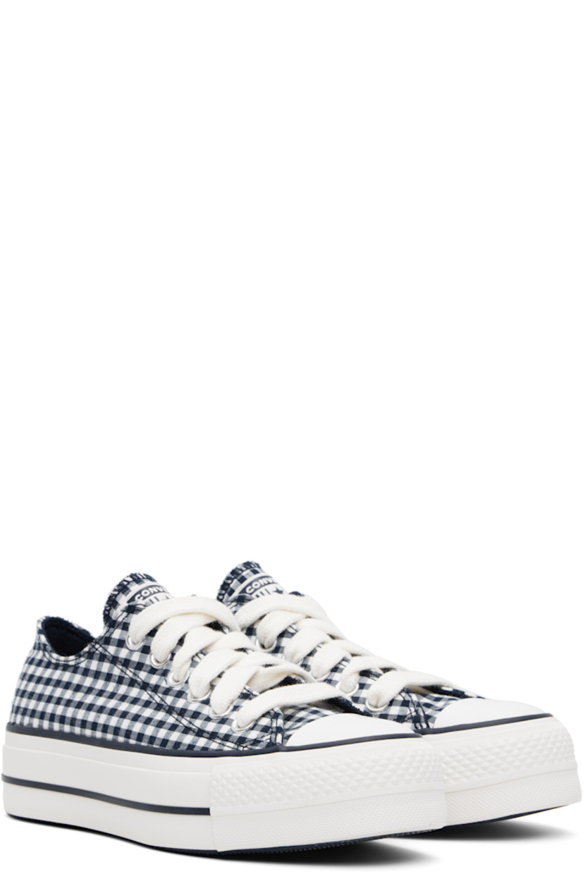 Low-top canvas sneakers in navy and white.

· Check pattern throughout
· Rubber cap toe
· Lace-up closure
· Logo patch at tongue
· Eyelets at inner side
· Rubberized logo patch at heel
· Cushioned OrthoLite® footbed
· Treaded rubber platform sole
· Platform: H1.5"

Supplier color: Obsidian/White/Vintage white