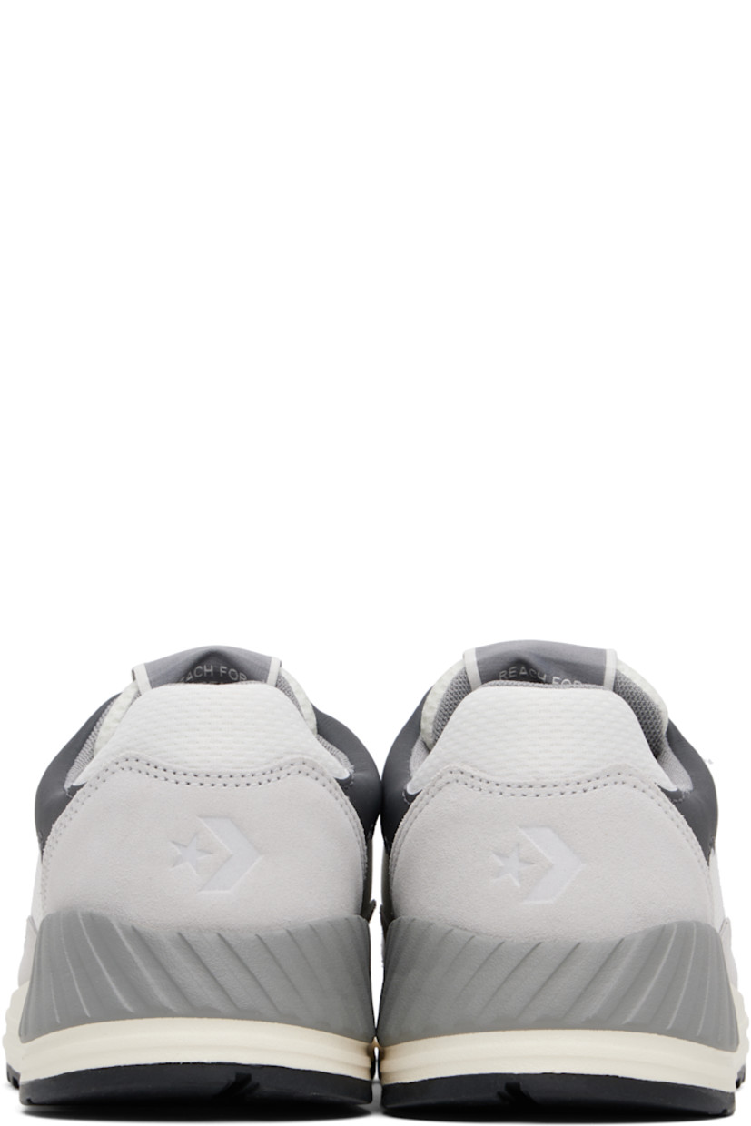 Low-top suede and mesh sneakers in gray.

· Lace-up closure
· Logo flag at padded tongue
· Padded collar
· Logo embroidered at sides 
· Logo embossed at heel counter
· Cushioned CX foam footbed
· Mesh lining
· Treaded rubber sole

Supplier color: Barely grey/Vintage white