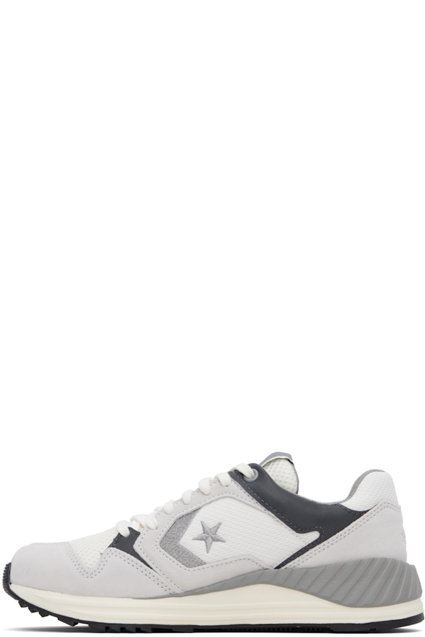 Low-top suede and mesh sneakers in gray.

· Lace-up closure
· Logo flag at padded tongue
· Padded collar
· Logo embroidered at sides 
· Logo embossed at heel counter
· Cushioned CX foam footbed
· Mesh lining
· Treaded rubber sole

Supplier color: Barely grey/Vintage white