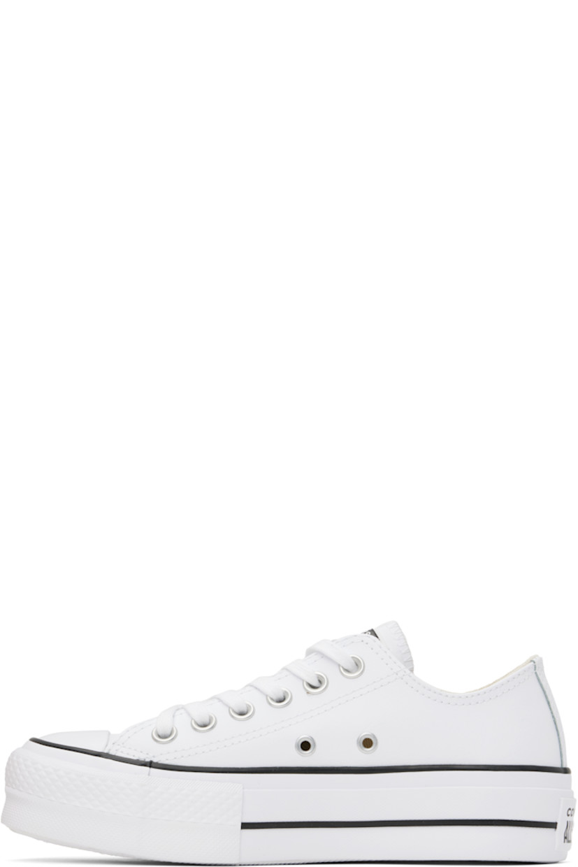 Low-top buffed leather sneakers in white.

· Rubber cap toe
· Lace-up closure
· Logo patch at tongue
· Eyelets at inner side
· Mesh lining
· Rubberized logo patch at heel
· Treaded rubber platform sole
· Platform: H1.5"

Supplier color: White/Black