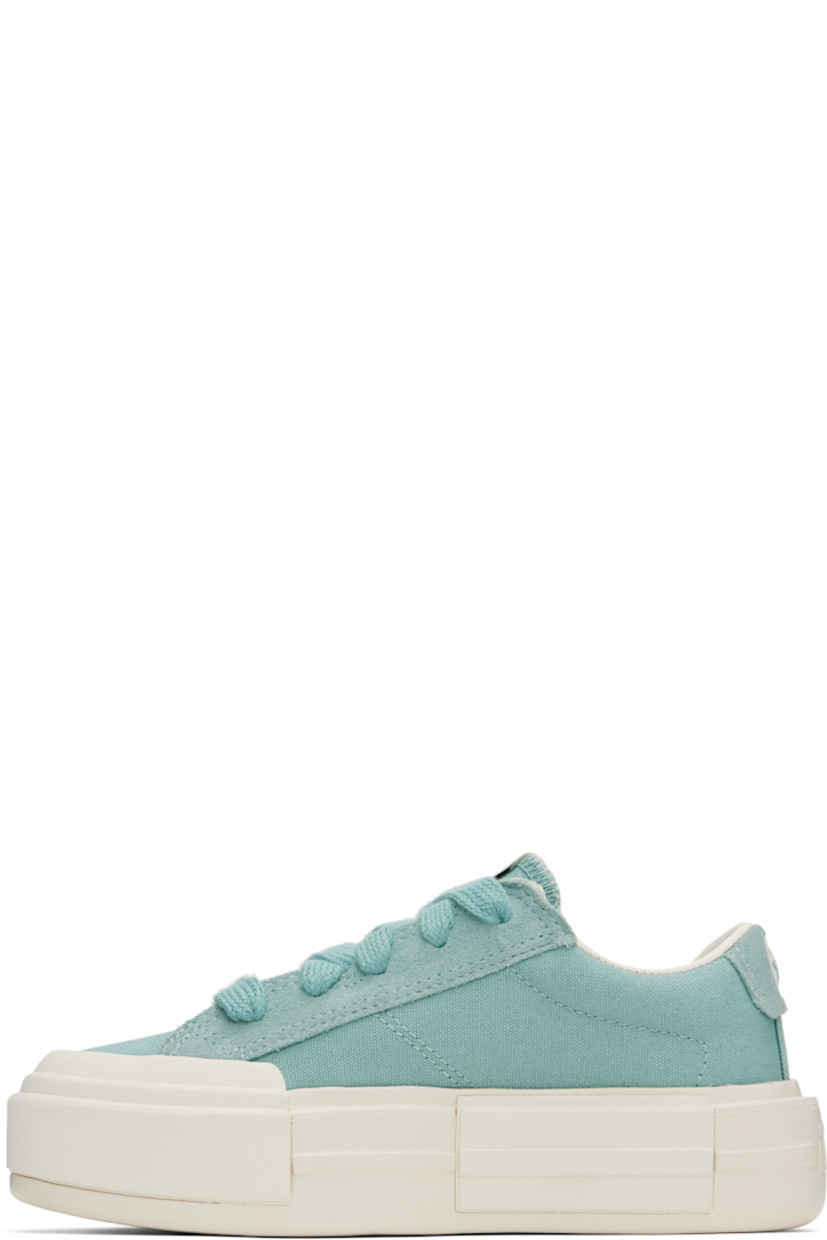 Low-top lightweight canvas and suede sneakers in blue.

· Lace-up closure
· Logo printed at tongue and heel
· Padded collar
· Cushioned OrthoLite® insole
· Treaded rubber platform sole
· Platform: H2"

Supplier color: Vernal pool/Egret/Gold