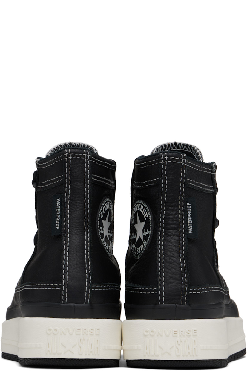 High-top waterproof grained leather sneakers in black.

· Lace-up closure
· Logo patch at inner side
· Logo embossed at heel
· Cushioned OrthoLite® footbed
· Water-resistant 3M Thinsulate™ mesh lining
· Foam rubber midsole
· Treaded rubber sole
· Contrast stitching in white

Supplier color: Black/Black/Vintage white