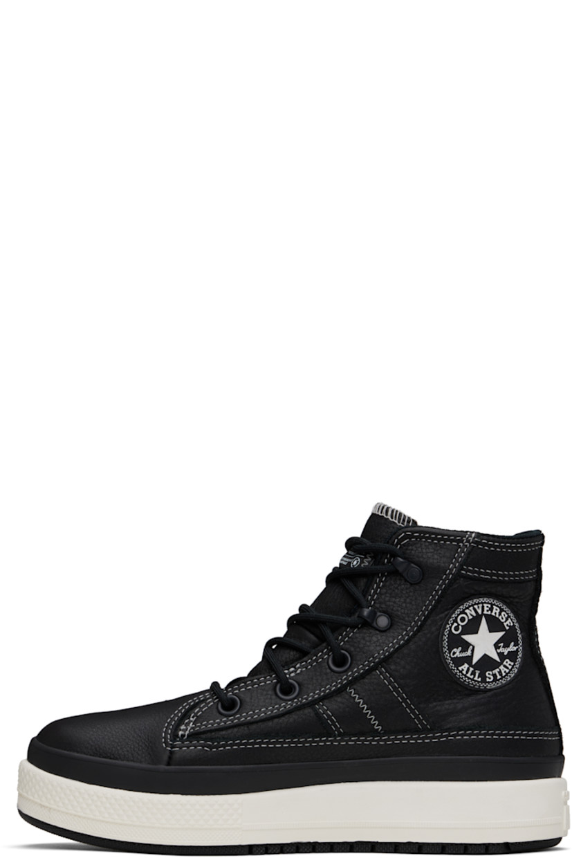 High-top waterproof grained leather sneakers in black.

· Lace-up closure
· Logo patch at inner side
· Logo embossed at heel
· Cushioned OrthoLite® footbed
· Water-resistant 3M Thinsulate™ mesh lining
· Foam rubber midsole
· Treaded rubber sole
· Contrast stitching in white

Supplier color: Black/Black/Vintage white