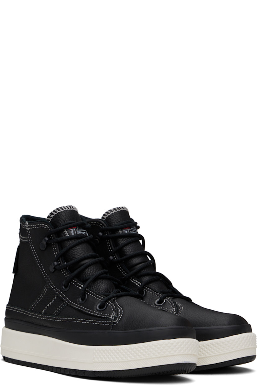High-top waterproof grained leather sneakers in black.

· Lace-up closure
· Logo patch at inner side
· Logo embossed at heel
· Cushioned OrthoLite® footbed
· Water-resistant 3M Thinsulate™ mesh lining
· Foam rubber midsole
· Treaded rubber sole
· Contrast stitching in white

Supplier color: Black/Black/Vintage white