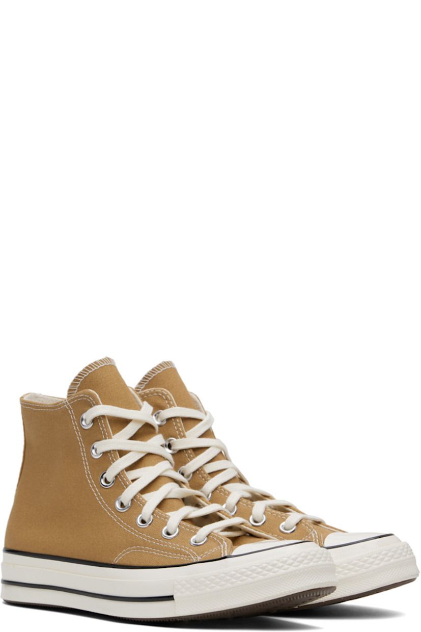 High-top canvas sneakers in tan.

· Rubber cap toe
· Lace-up closure
· Logo patch and eyelets at inner side
· Cushioned OrthoLite® footbed
· Canvas lining
· Rubber logo patch at midsole
· Treaded rubber sole
· Contrast stitching in off-white

Supplier color: Toadstool tan/Egret/Black