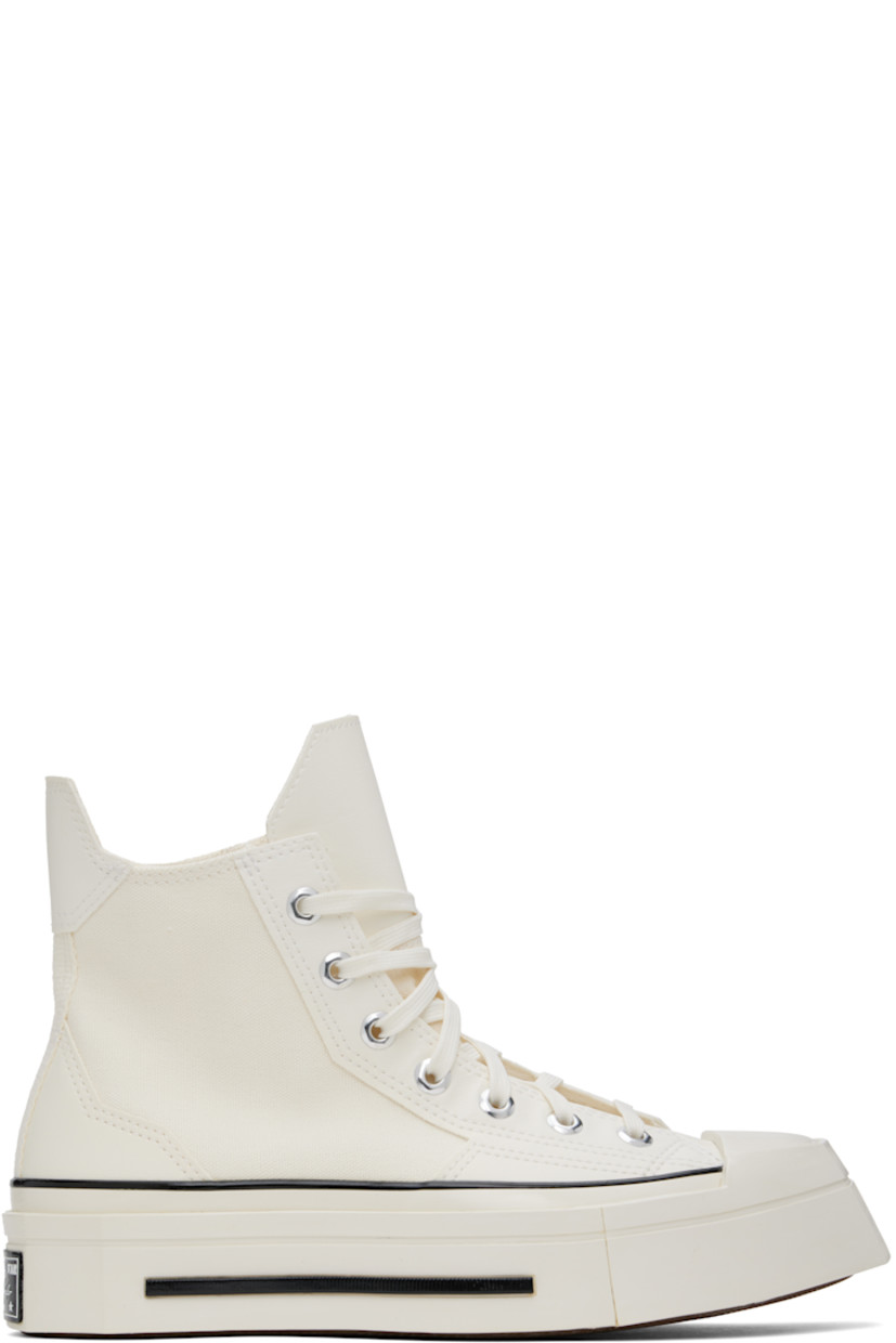 High-top canvas and faux-leather sneakers in off-white.

· Square rubber cap toe
· Lace-up closure
· Pull-tab at heel collar
· Logo patch and eyelets at inner side
· Cushioned Ortholite® footbed
· Rubber logo patch at sculptural midsole
· Treaded rubber sole

Supplier color: Egret/Black/Egret