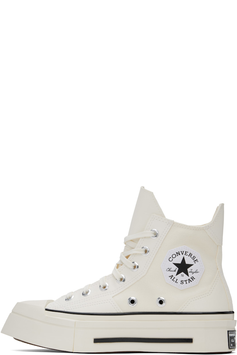 High-top canvas and faux-leather sneakers in off-white.

· Square rubber cap toe
· Lace-up closure
· Pull-tab at heel collar
· Logo patch and eyelets at inner side
· Cushioned Ortholite® footbed
· Rubber logo patch at sculptural midsole
· Treaded rubber sole

Supplier color: Egret/Black/Egret