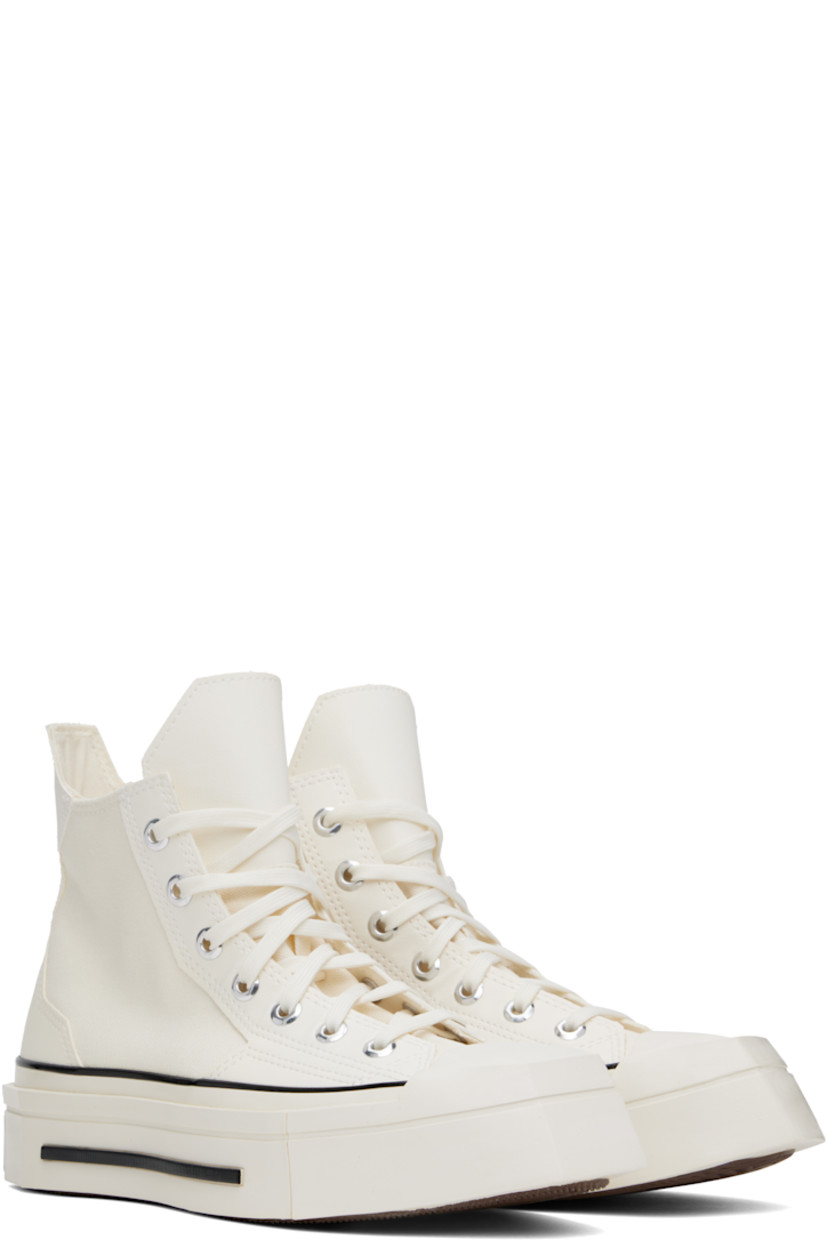 High-top canvas and faux-leather sneakers in off-white.

· Square rubber cap toe
· Lace-up closure
· Pull-tab at heel collar
· Logo patch and eyelets at inner side
· Cushioned Ortholite® footbed
· Rubber logo patch at sculptural midsole
· Treaded rubber sole

Supplier color: Egret/Black/Egret
