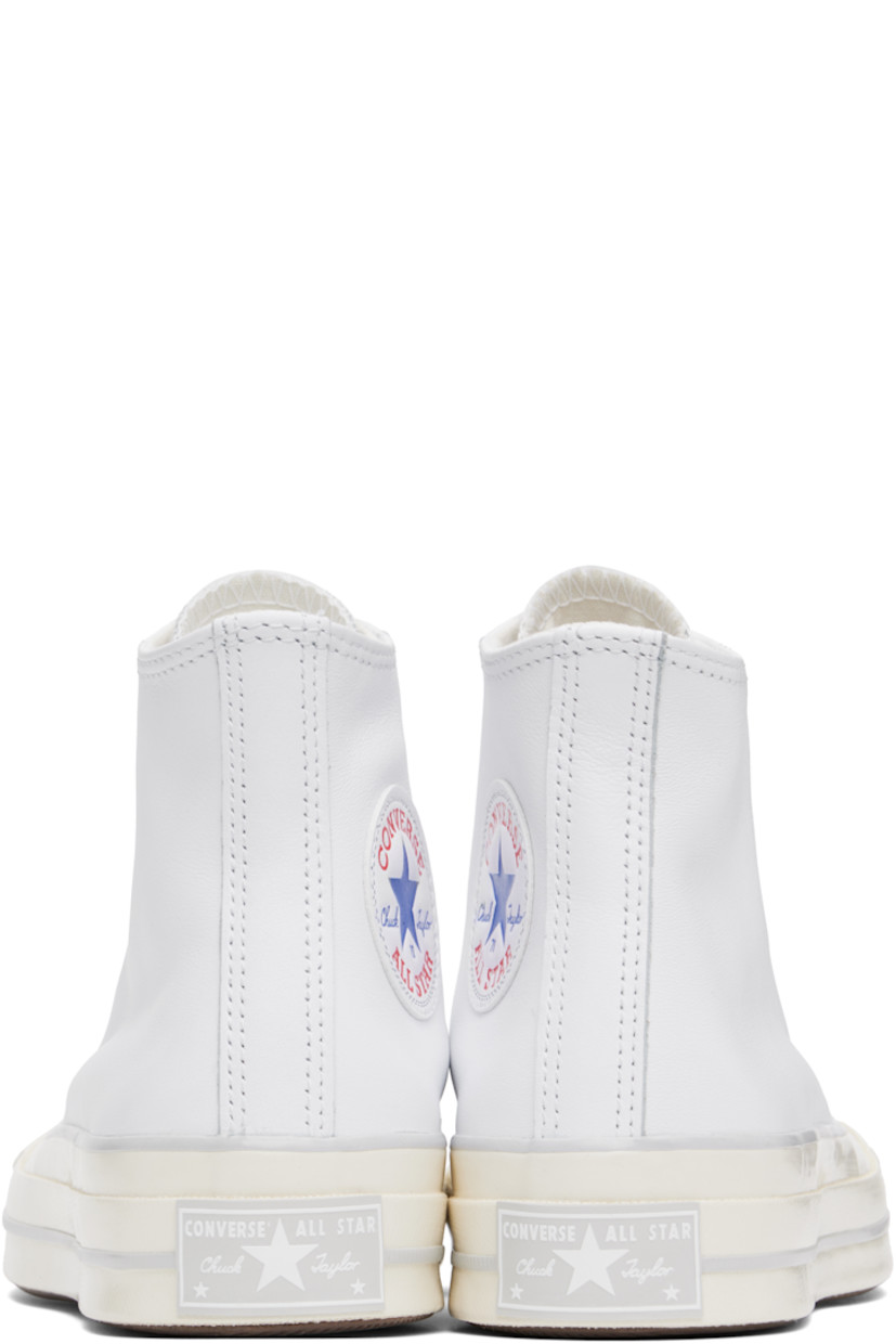 High-top grained leather sneakers in white.

· Rubber cap toe
· Lace-up closure
· Logo patch and eyelets at inner side
· Cushioned Ortholite® footbed
· Canvas lining
· Rubber logo patch at midsole
· Treaded rubber sole

Supplier color: White/Fossilized/Egret