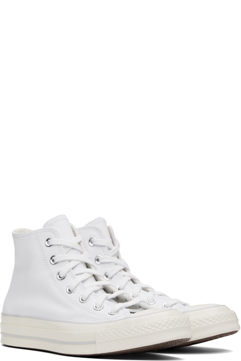 High-top grained leather sneakers in white.

· Rubber cap toe
· Lace-up closure
· Logo patch and eyelets at inner side
· Cushioned Ortholite® footbed
· Canvas lining
· Rubber logo patch at midsole
· Treaded rubber sole

Supplier color: White/Fossilized/Egret