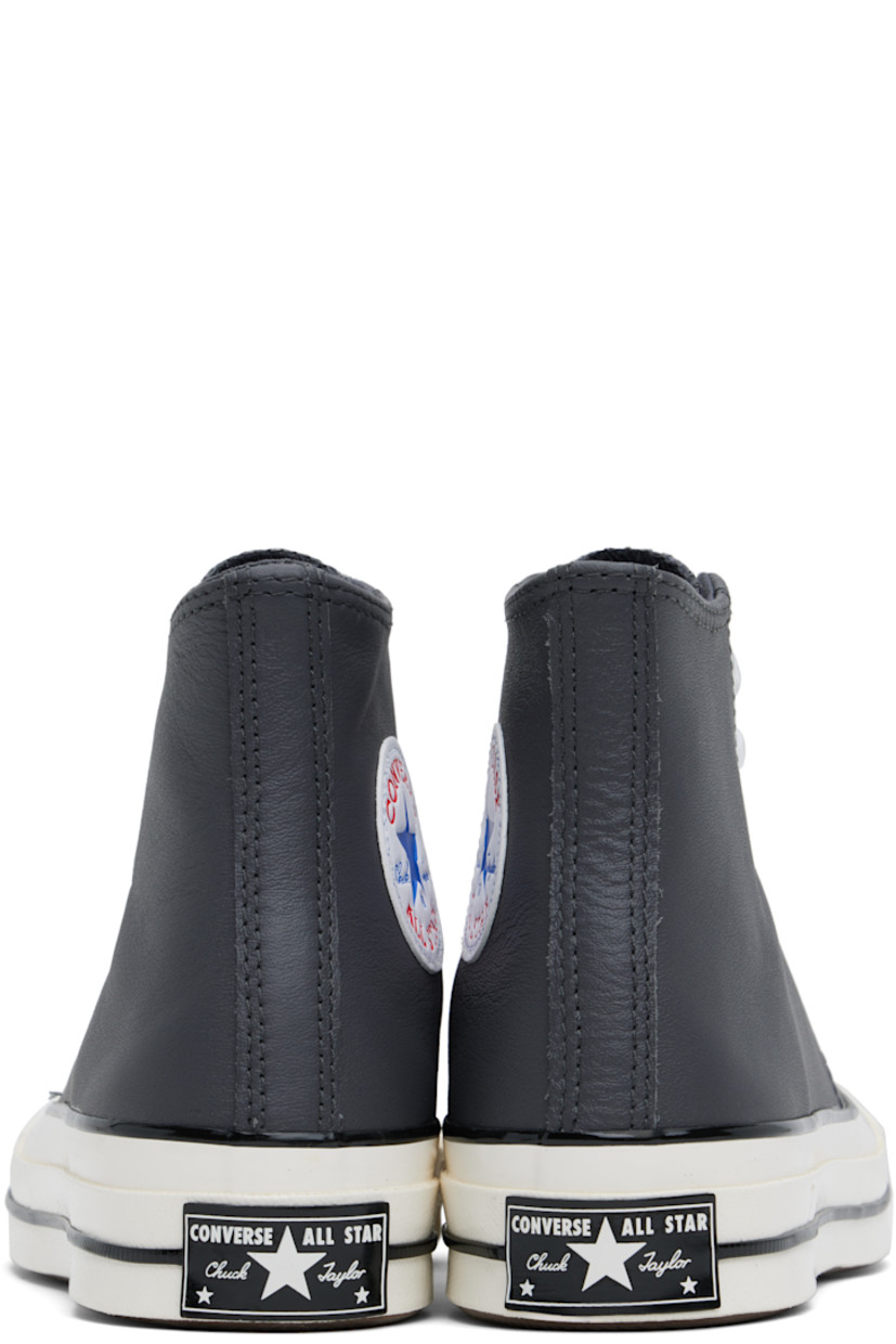 High-top grained leather sneakers in gray.

· Rubber cap toe
· Lace-up closure
· Logo patch and eyelets at inner side
· Rubberized logo patch at heel
· Cushioned OrthoLite® footbed
· Canvas lining
· Treaded rubber sole

Supplier color: Dark matter/Shadow purple/White
