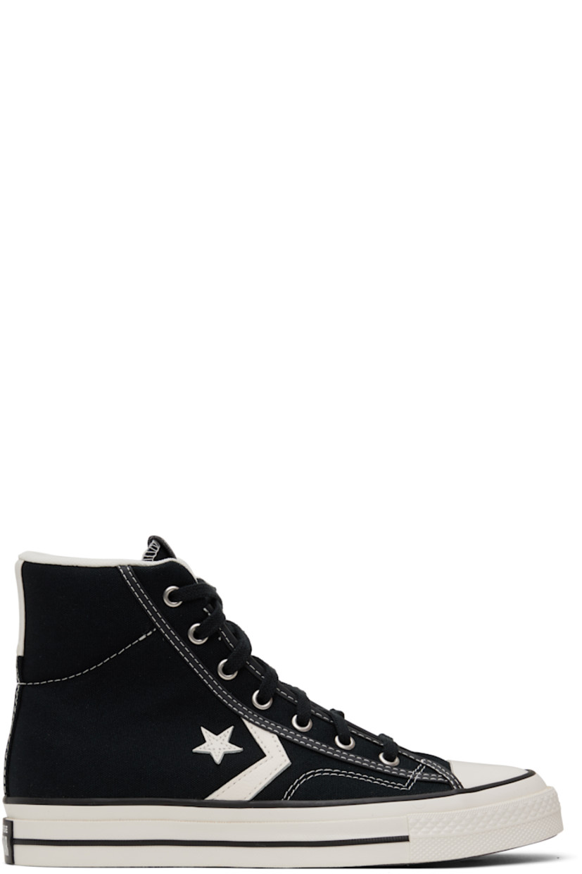 High-top canvas sneakers in black.

· Rubber cap toe
· Lace-up closure
· Leather logo patch at padded tongue
· Padded collar
· Leather logo appliqué at sides
· Rubberized logo patch at heel
· Cushioned OrthoLite® footbed
· Mesh lining
· Treaded rubber sole
· Contrast stitching in white

Supplier color: Black/Vintage white