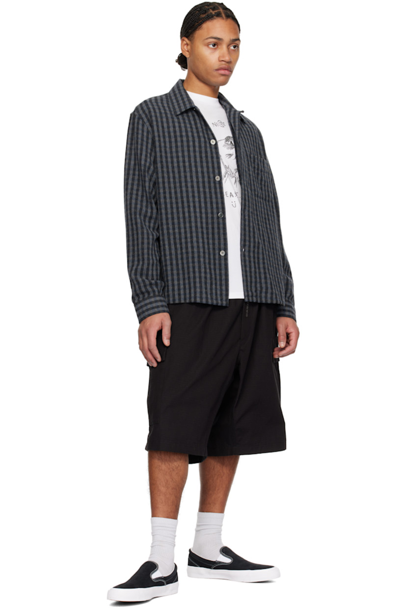Low-top suede slip-on sneakers in black.

· Elasticized gussets at vamp
· Padded collar
· Logo cutout at heel counter
· Cushioned CX foam insole
· Suede lining
· Rubber logo patch at heel
· Textured rubber midsole
· CONS treaded rubber sole
· Contrast stitching in white

Supplier color: Black/White/White