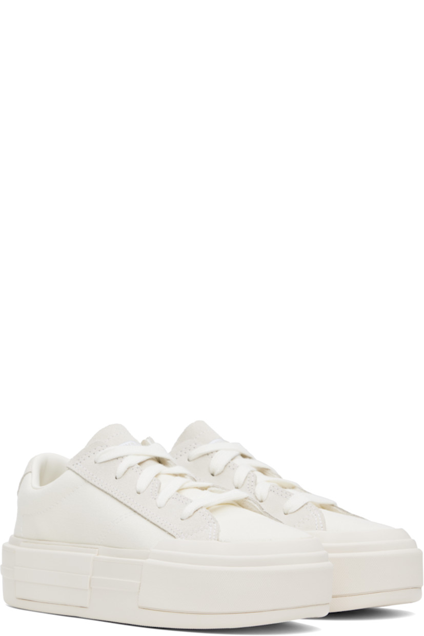 Low-top canvas sneakers in off-white.

· Lace-up closure
· Logo embossed at tongue and heel
· Padded tongue and collar
· Cushioned OrthoLite® footbed
· Mesh lining
· Logo embossed at platform midsole
· Treaded rubber sole
· Platform: H2"

Supplier color: Egret/White/Egret