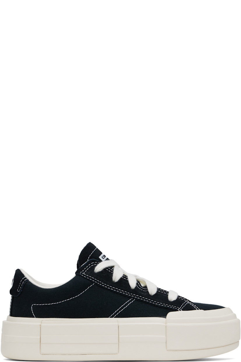 Low-top canvas sneakers in black.

· Lace-up closure
· Logo embossed at tongue and heel
· Padded tongue and collar
· Cushioned OrthoLite® footbed
· Mesh lining
· Logo embossed at platform midsole
· Treaded rubber sole
· Contrast stitching in white
· Platform: H2"

Supplier color: Black/White/Black