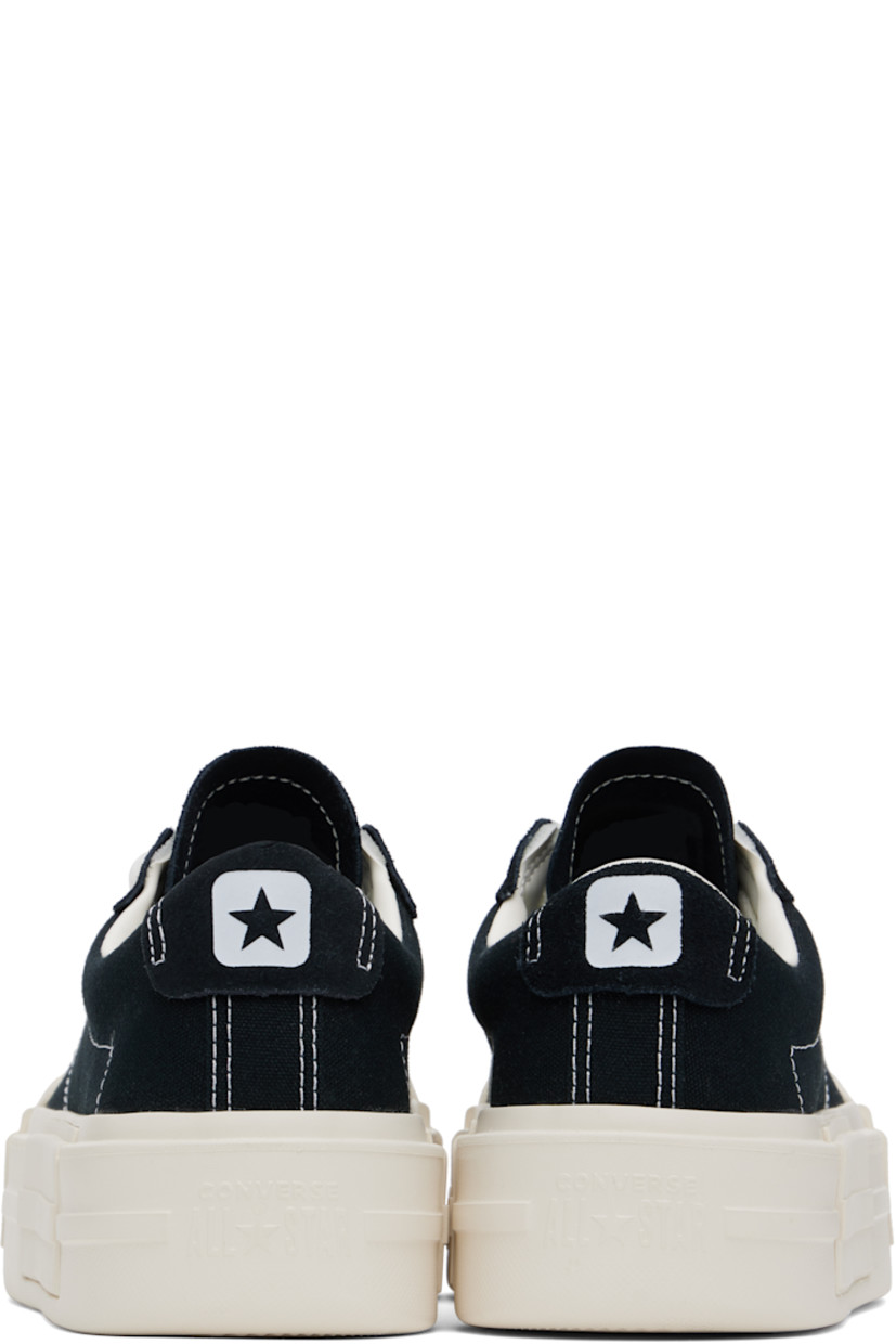 Low-top canvas sneakers in black.

· Lace-up closure
· Logo embossed at tongue and heel
· Padded tongue and collar
· Cushioned OrthoLite® footbed
· Mesh lining
· Logo embossed at platform midsole
· Treaded rubber sole
· Contrast stitching in white
· Platform: H2"

Supplier color: Black/White/Black