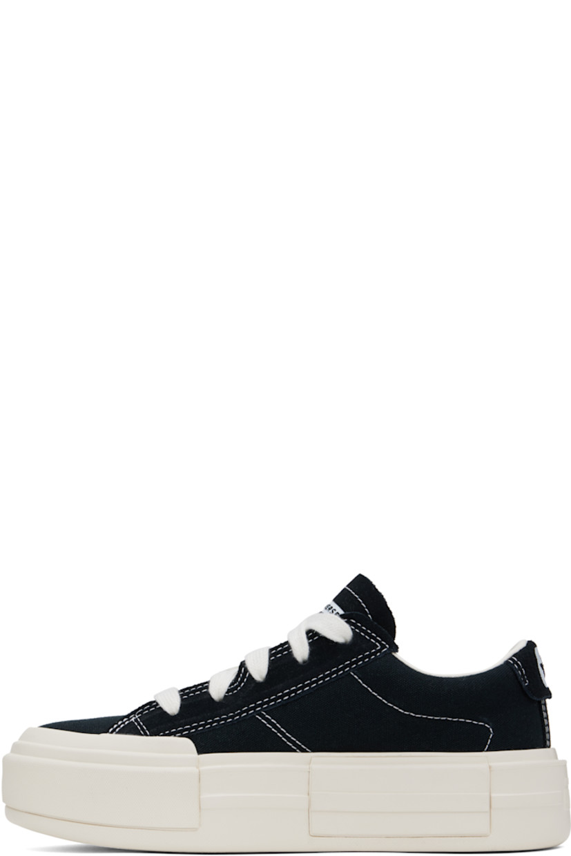 Low-top canvas sneakers in black.

· Lace-up closure
· Logo embossed at tongue and heel
· Padded tongue and collar
· Cushioned OrthoLite® footbed
· Mesh lining
· Logo embossed at platform midsole
· Treaded rubber sole
· Contrast stitching in white
· Platform: H2"

Supplier color: Black/White/Black