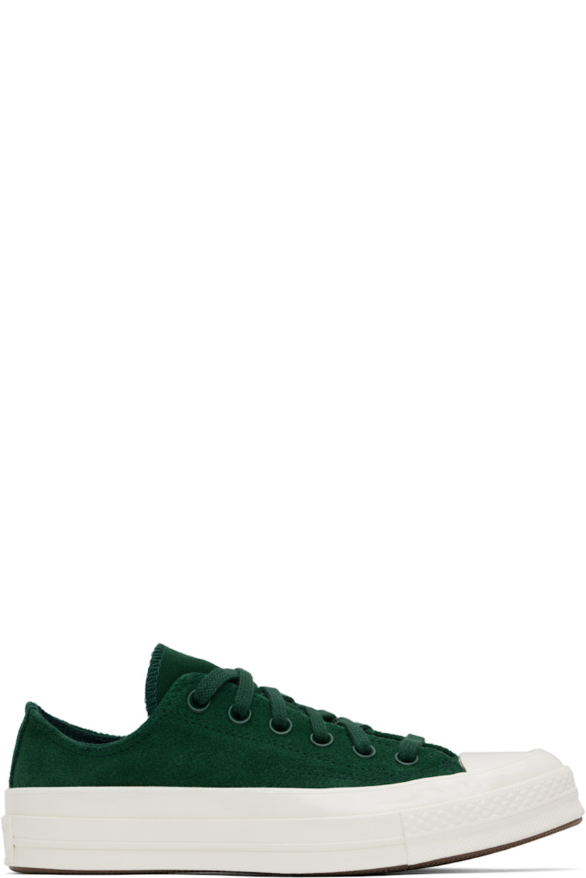Low-top suede sneakers in green.

· Rubber cap toe
· Lace-up closure
· Eyelets at inner side
· Rubberized logo patch at heel
· Cushioned OrthoLite® footbed
· Canvas lining
· Treaded rubber sole

Supplier color: Green envy/Egret/ Green