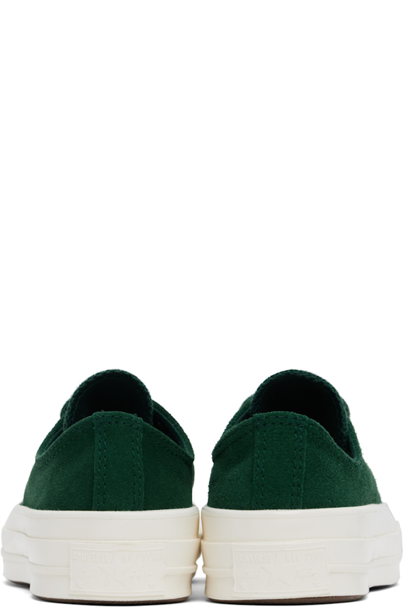 Low-top suede sneakers in green.

· Rubber cap toe
· Lace-up closure
· Eyelets at inner side
· Rubberized logo patch at heel
· Cushioned OrthoLite® footbed
· Canvas lining
· Treaded rubber sole

Supplier color: Green envy/Egret/ Green