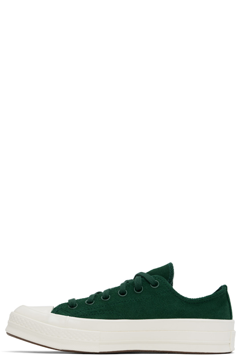 Low-top suede sneakers in green.

· Rubber cap toe
· Lace-up closure
· Eyelets at inner side
· Rubberized logo patch at heel
· Cushioned OrthoLite® footbed
· Canvas lining
· Treaded rubber sole

Supplier color: Green envy/Egret/ Green