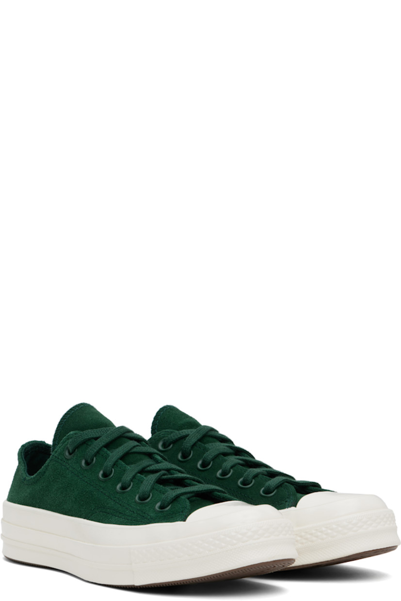 Low-top suede sneakers in green.

· Rubber cap toe
· Lace-up closure
· Eyelets at inner side
· Rubberized logo patch at heel
· Cushioned OrthoLite® footbed
· Canvas lining
· Treaded rubber sole

Supplier color: Green envy/Egret/ Green