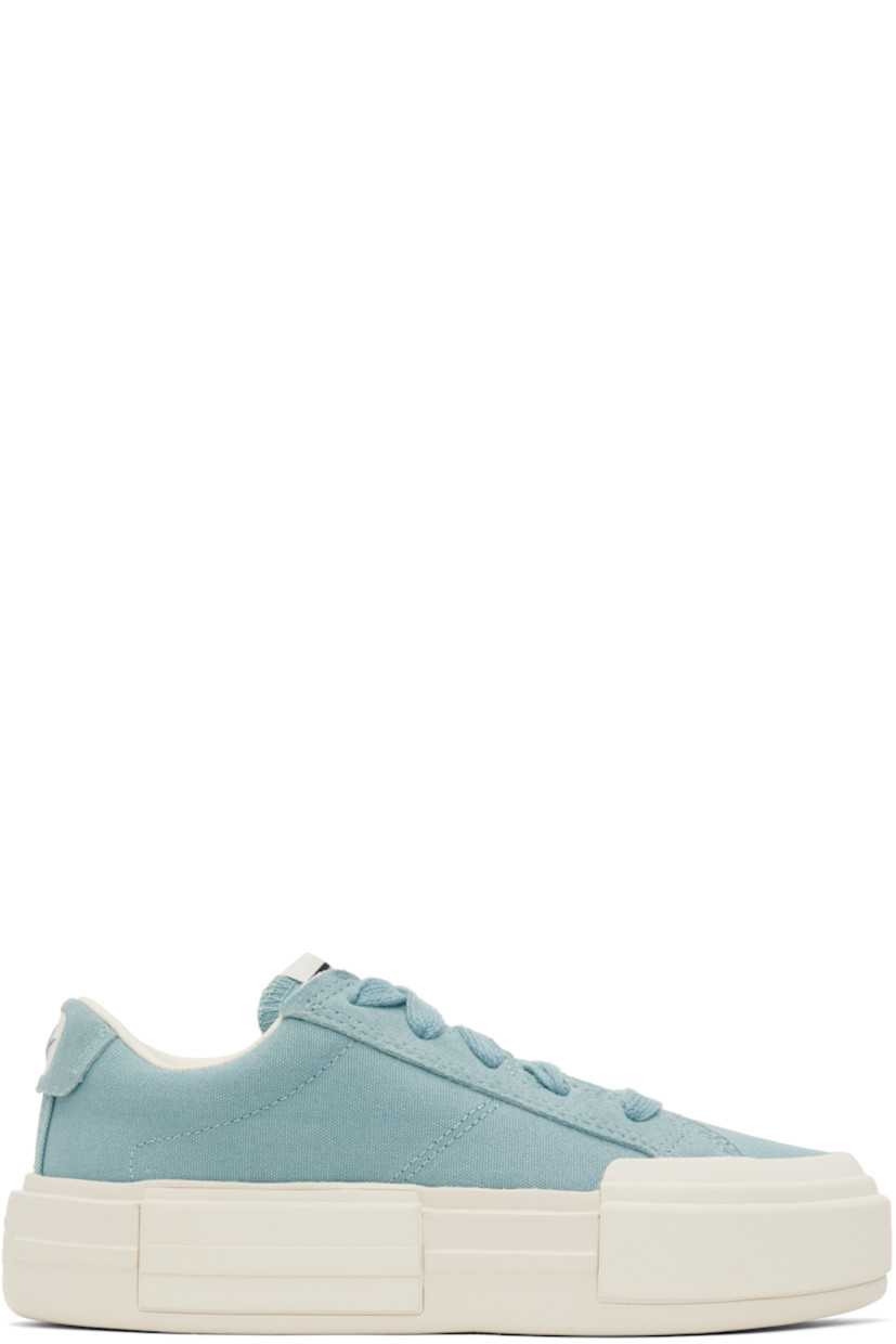 Low-top lightweight canvas and suede sneakers in blue.

· Lace-up closure
· Logo patch at padded tongue
· Padded collar
· Logo stamp at heel tab
· Cushioned OrthoLite® footbed
· Mesh lining
· Logo embossed at rubber platform midsole
· Treaded rubber sole
· Platform: H1.75"

Supplier color: Vernal pool/Egret/Gold
