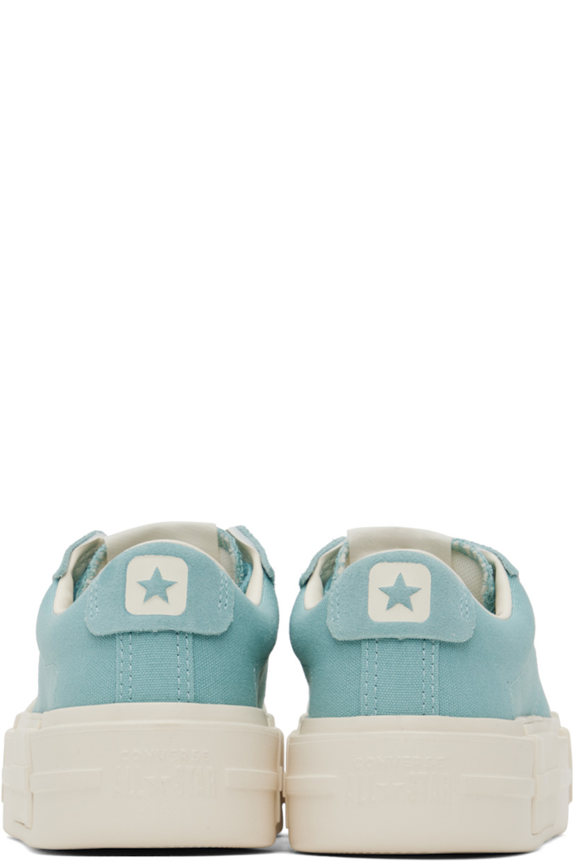 Low-top lightweight canvas and suede sneakers in blue.

· Lace-up closure
· Logo patch at padded tongue
· Padded collar
· Logo stamp at heel tab
· Cushioned OrthoLite® footbed
· Mesh lining
· Logo embossed at rubber platform midsole
· Treaded rubber sole
· Platform: H1.75"

Supplier color: Vernal pool/Egret/Gold
