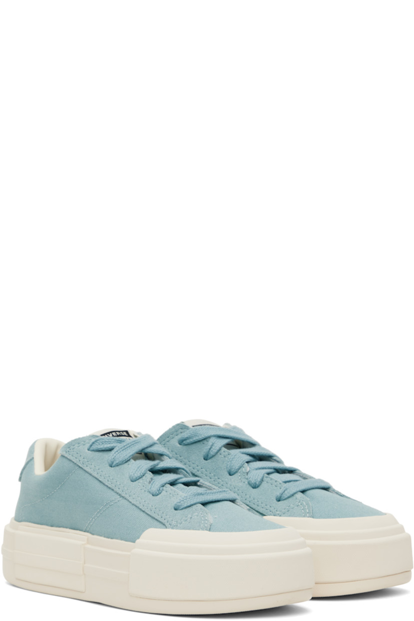 Low-top lightweight canvas and suede sneakers in blue.

· Lace-up closure
· Logo patch at padded tongue
· Padded collar
· Logo stamp at heel tab
· Cushioned OrthoLite® footbed
· Mesh lining
· Logo embossed at rubber platform midsole
· Treaded rubber sole
· Platform: H1.75"

Supplier color: Vernal pool/Egret/Gold