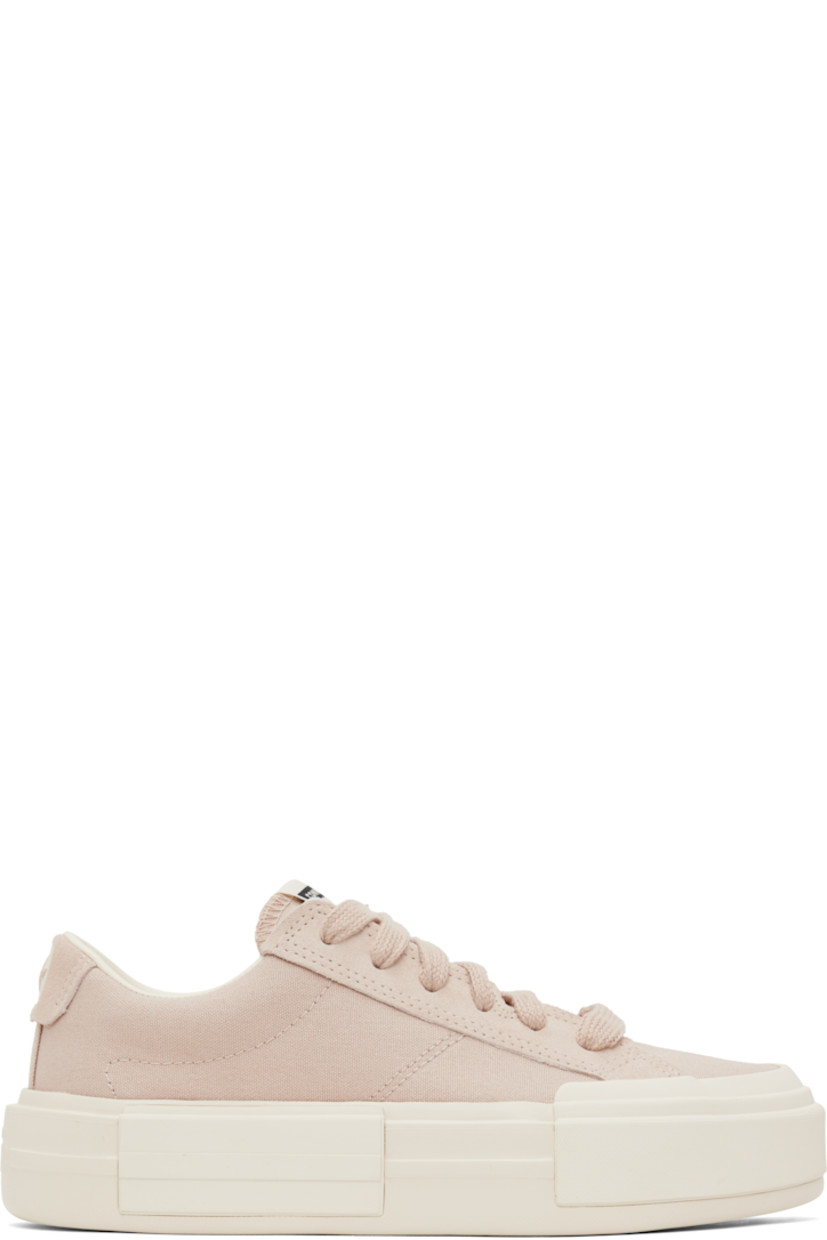 Low-top lightweight canvas and suede sneakers in pink.

· Lace-up closure
· Logo patch at padded tongue
· Padded collar
· Logo stamp at heel tab
· Cushioned OrthoLite® footbed
· Mesh lining
· Logo embossed at rubber platform midsole
· Treaded rubber sole
· Platform: H1.75"

Supplier color: Warm clay/Egret/Black