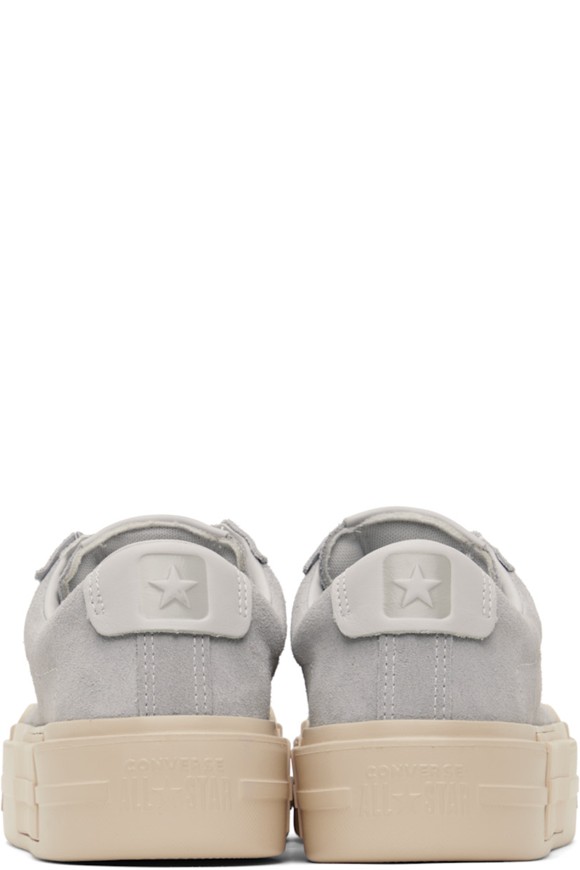 Low-top lightweight suede sneakers in gray.

· Lace-up closure
· Logo embossed at padded tongue and heel tab
· Padded collar
· Cushioned OrthoLite® footbed
· Mesh lining
· Logo embossed at rubber platform midsole
· Treaded rubber sole
· Platform: H1.75"

Supplier color: Grey area/Natural ivory