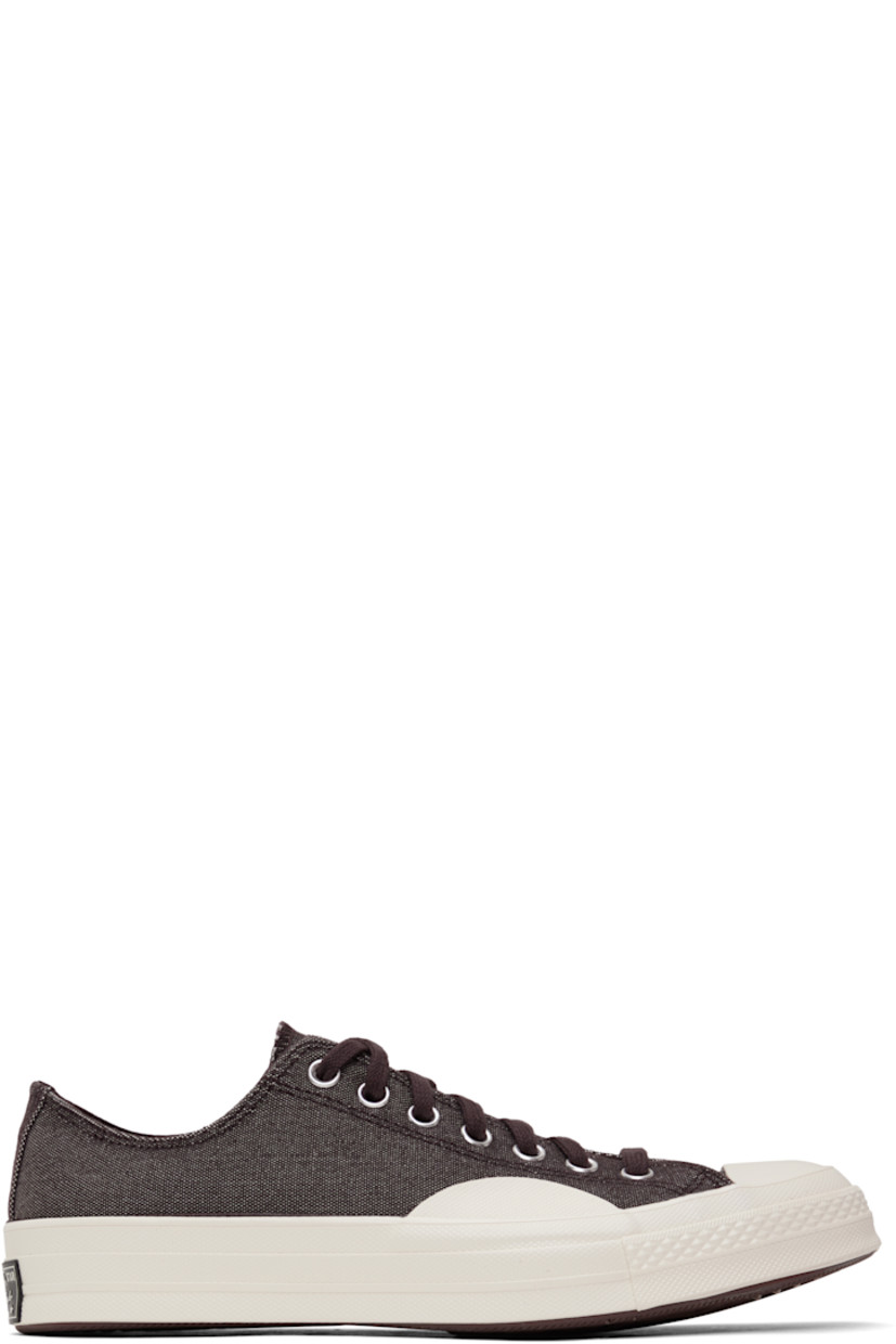 Low-top canvas sneakers in burgundy.

· Textured rubber cap toe
· Lace-up closure
· Eyelets at inner side
· Rubberized logo patch at heel
· Cushioned OrthoLite® footbed
· Textured treaded rubber sole

Supplier color: Rugged brown/Rugged brown