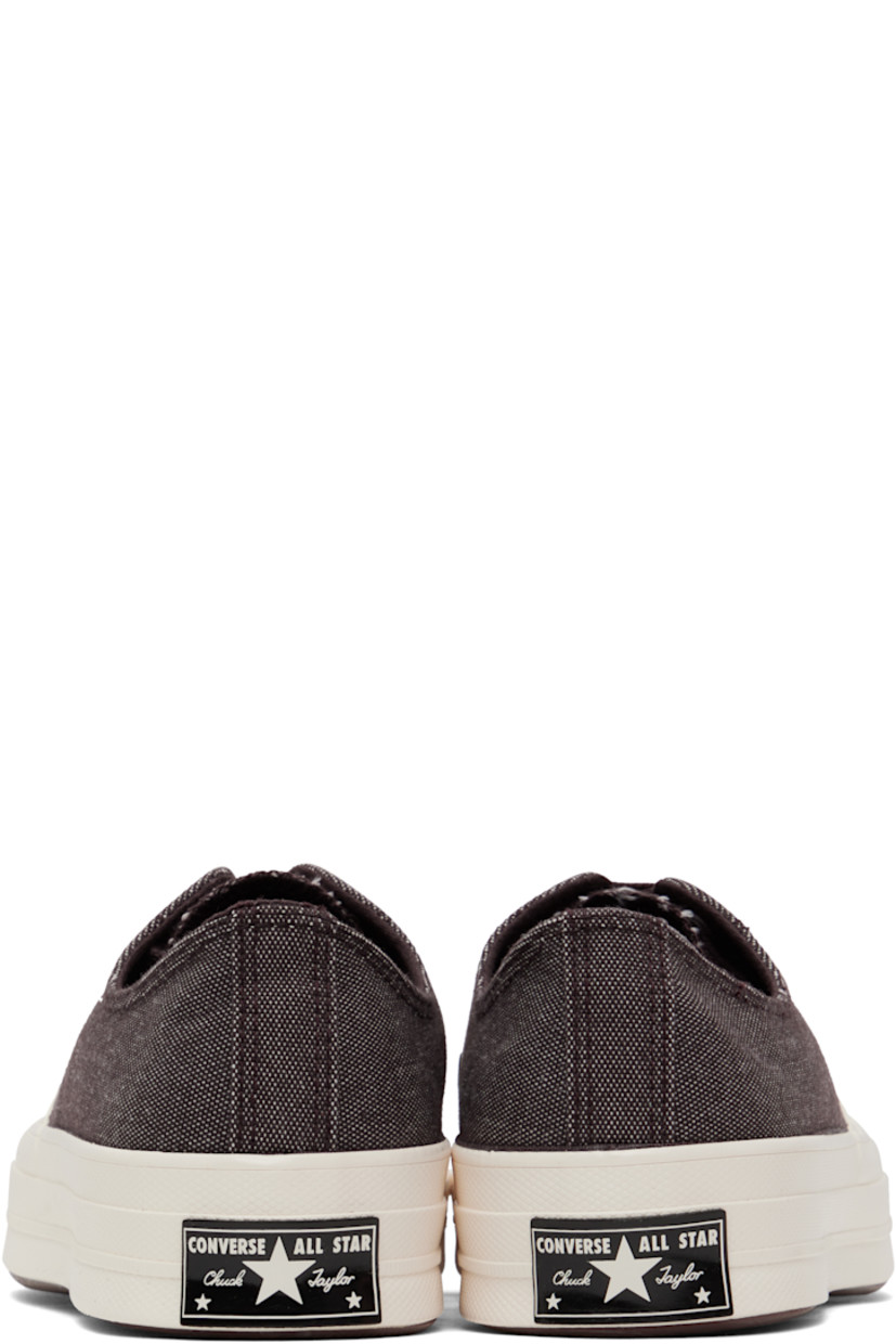Low-top canvas sneakers in burgundy.

· Textured rubber cap toe
· Lace-up closure
· Eyelets at inner side
· Rubberized logo patch at heel
· Cushioned OrthoLite® footbed
· Textured treaded rubber sole

Supplier color: Rugged brown/Rugged brown