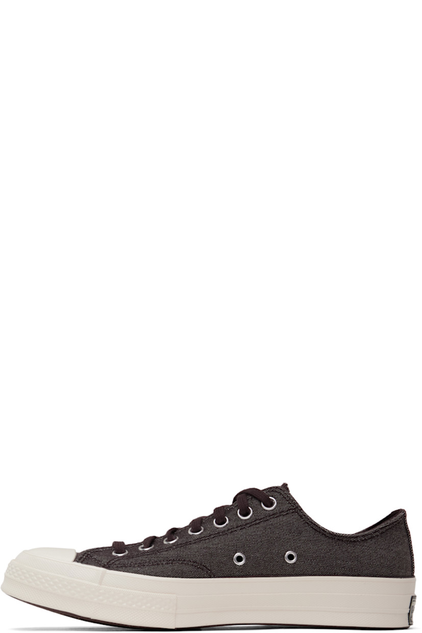 Low-top canvas sneakers in burgundy.

· Textured rubber cap toe
· Lace-up closure
· Eyelets at inner side
· Rubberized logo patch at heel
· Cushioned OrthoLite® footbed
· Textured treaded rubber sole

Supplier color: Rugged brown/Rugged brown